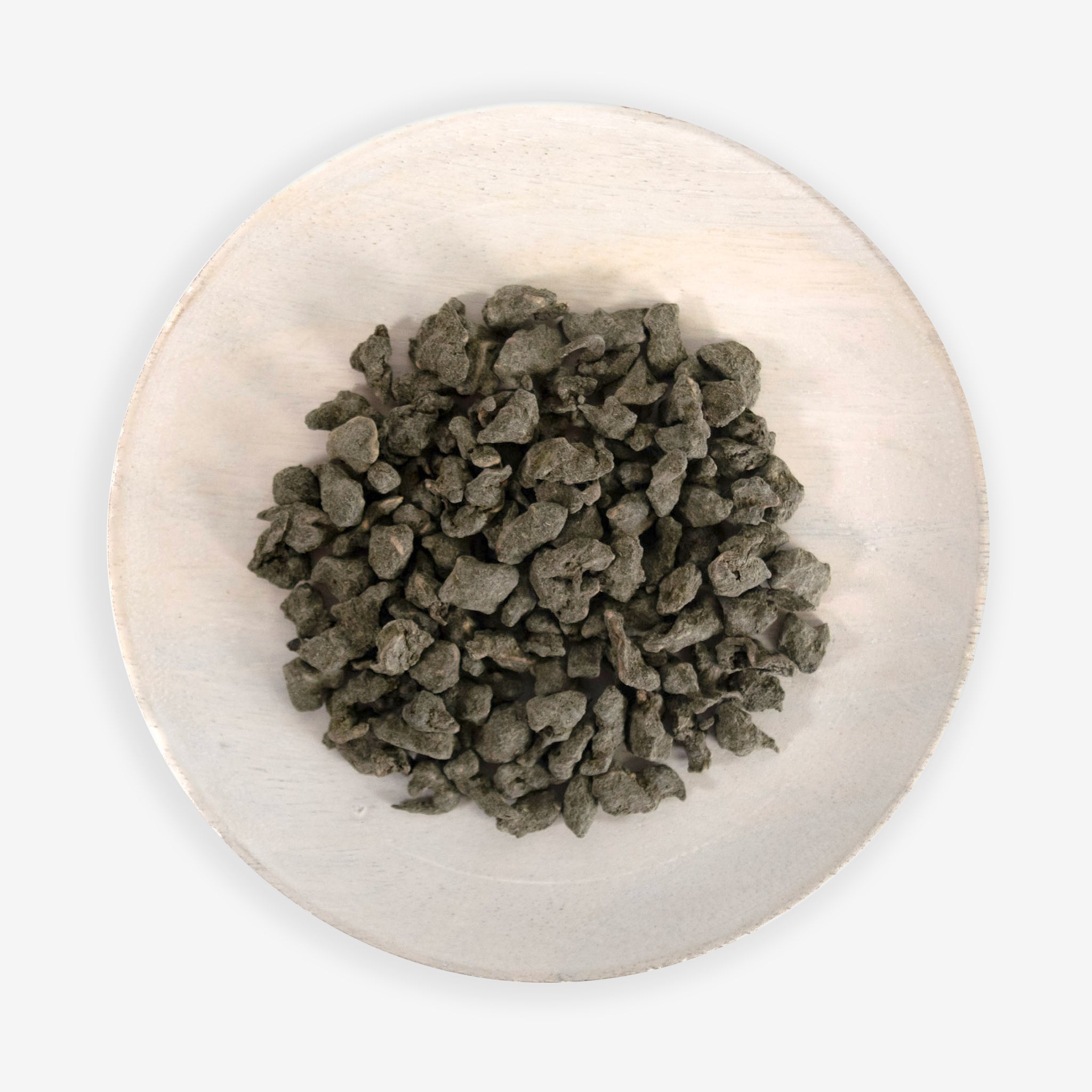 A plate with Ginseng Oolong tea leaves on a white background.