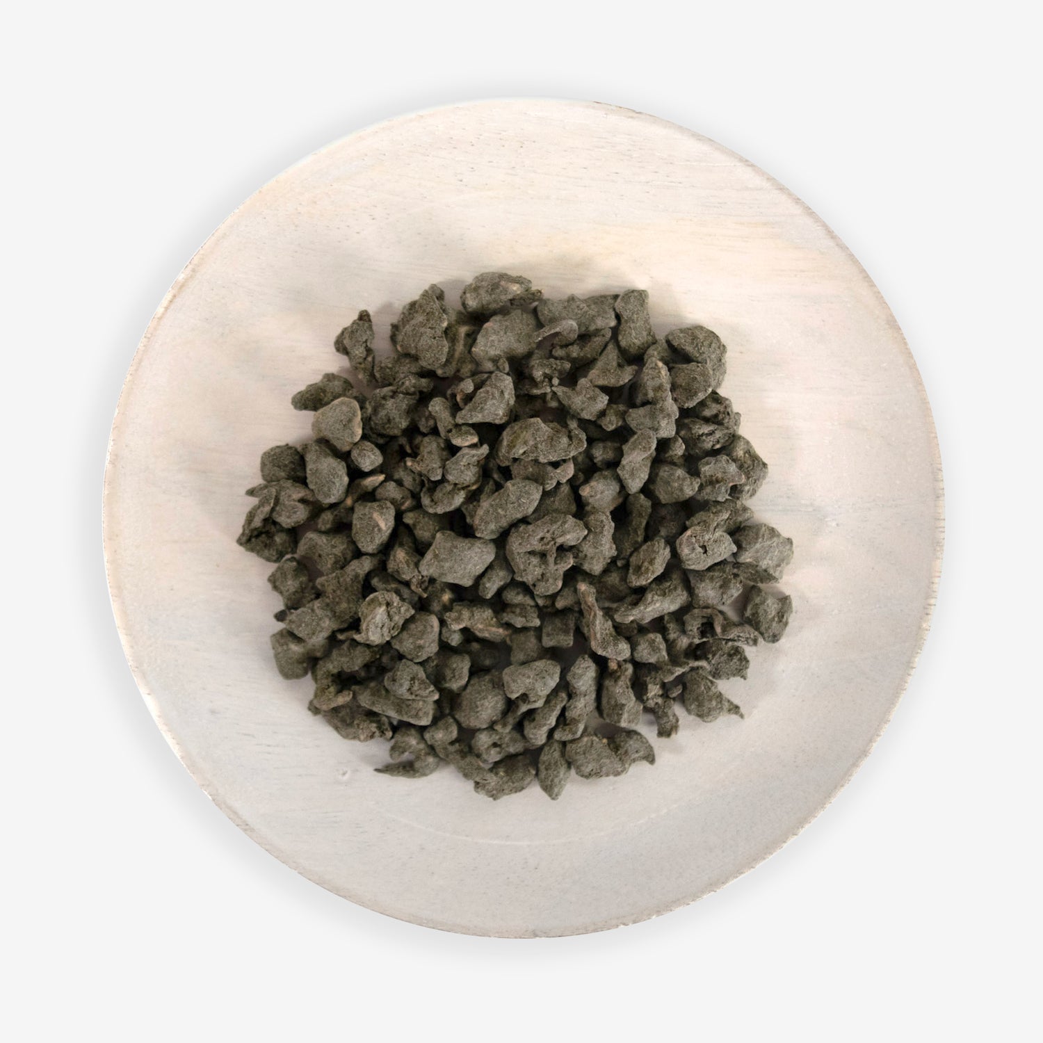 A plate with Ginseng Oolong tea leaves on a white background.