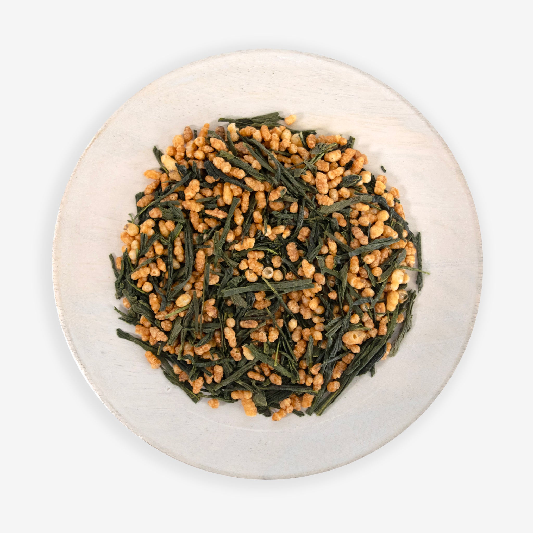 A plate of Japanese Genmaicha tea, which consists of green tea leaves and roasted, popped brown rice grains.