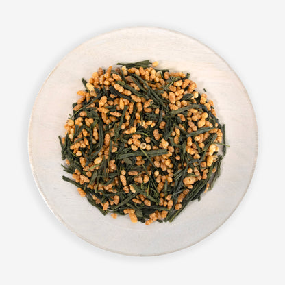 A plate of Japanese Genmaicha tea, which consists of green tea leaves and roasted, popped brown rice grains.