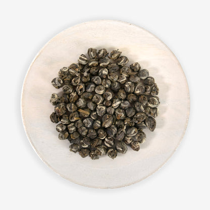 A plate with hand rolled jasmine green tea pearls.